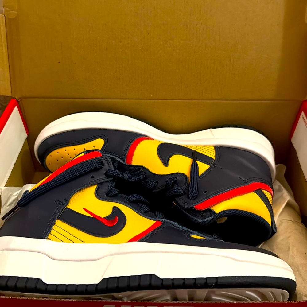 A Nike High Dunks very clean worn once size 9 in women's a dark color way.